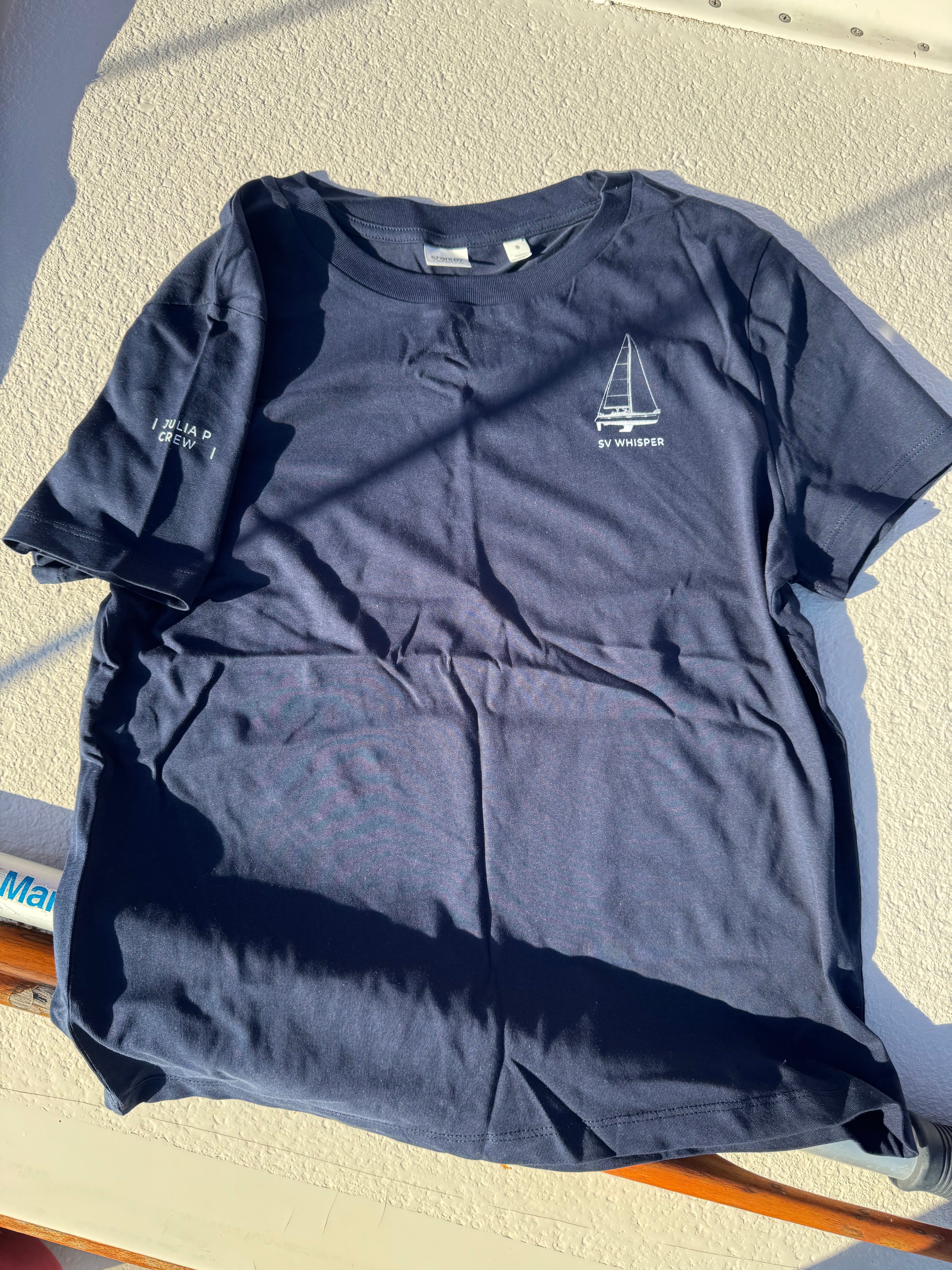 Real photo of navy crew tee with sailboat art