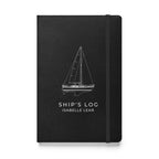 Catalina 34 ship's log with a line drawing of the boat on the Black cover