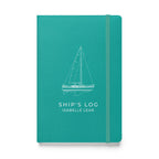 Catalina 34 ship's log with a line drawing of the boat on the Turquoise cover