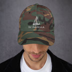 Custom sailboat dad hat in Green Camo with an embroidered line drawing of a Catalina 27 and the boat name SV ISABELLA